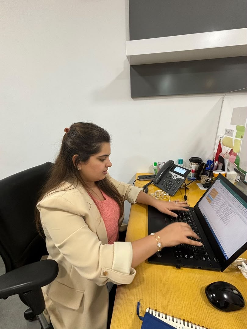 Company agent working at her office desk