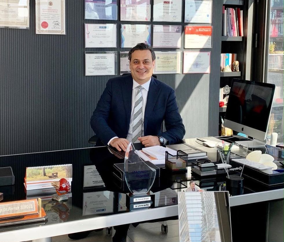 Gautam Ambani, company owner, seated at his office desk